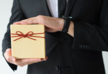 man holding event gift