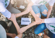 Close up of people volunteer teamwork join hands