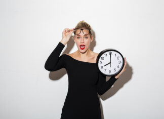 business woman holding clock